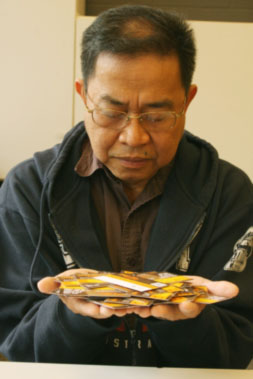 Pastor has hands full of commitment cards